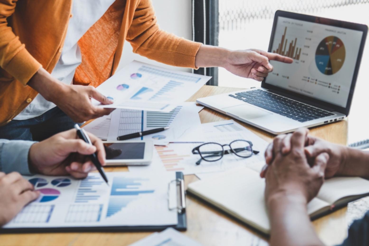 Professional business consultation workspace with strategic planning materials